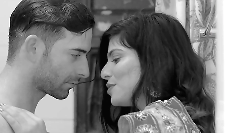 Milf in a sexy black dress takes a sexy look at a young guy