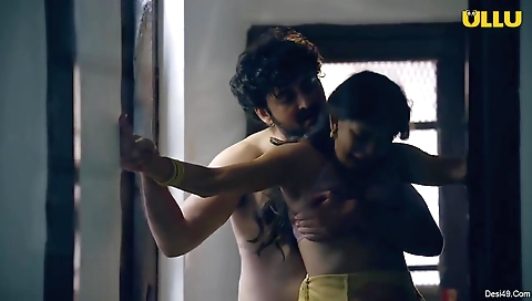 Busty brunette babe giving a handjob to her boyfriend