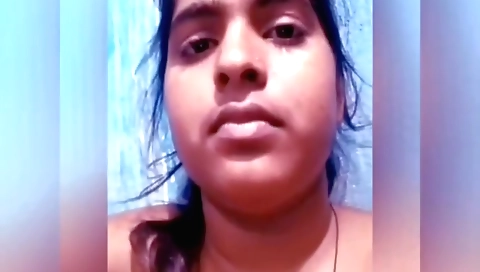 Indian teen in a suit shows off her tits on webcam
