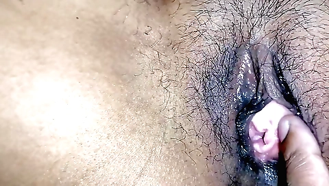 Indian girl stretches her hairy pussy and a toy in her pussy