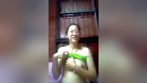 A sexy brunette is making a hot video in her home video clip