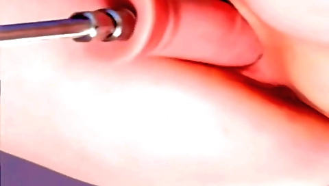 A brunette with pink skin is masturbating on her bed