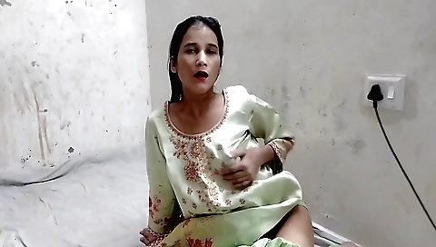 Indian brunette in red dress and a skirt masturbates