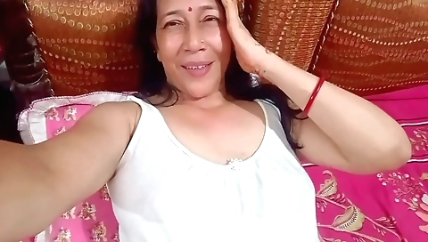 Indian milf masturbating on her bed with a big dick