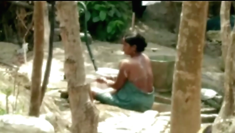 Gorgeous brunette takes a bath in the summer outdoor