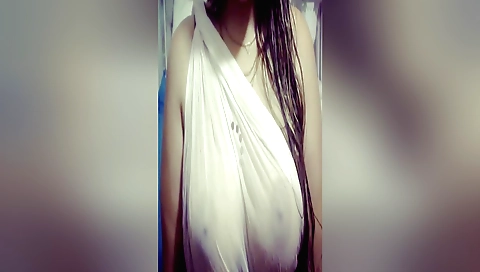 Indian brunette gets naked and shows off her big tits