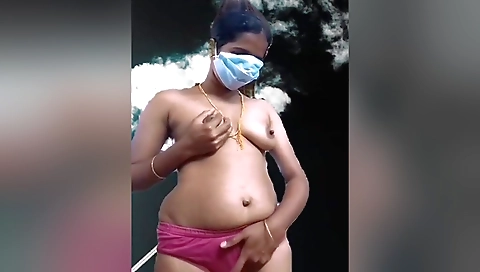 Indian beauty in a sexy outfit is showing off her body