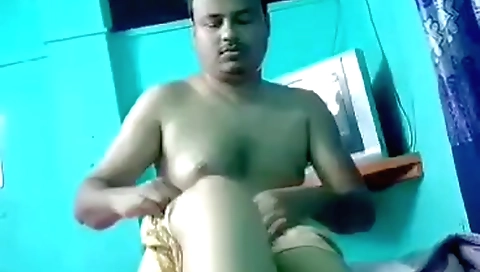 Big boobed brunette in a sexy black dress in a webcam clip