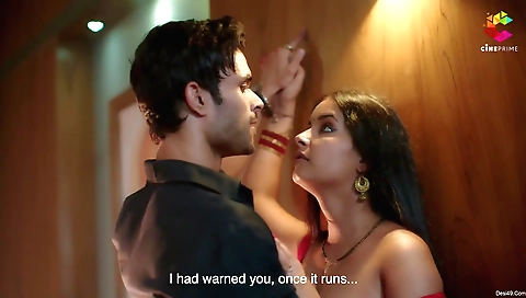 A brunette is in her home and she is showing off her tits