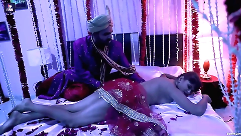 Sexy brunette in a cute red dress sucking a large phallus