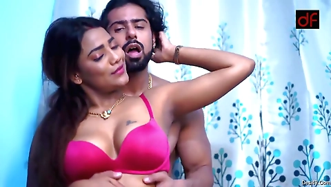 Busty brunette in a black dress and a black tie with big tits