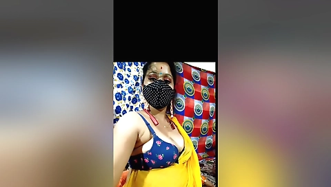 Bhabhi shows off her big boobs and pussy on the camera