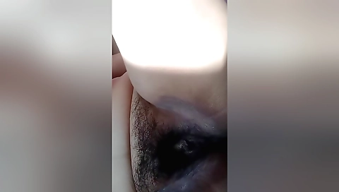 Sexy girl takes off clothes and massaged hairy pussy