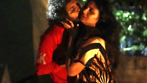 Indian girl with small tummy on terrace riding a stick