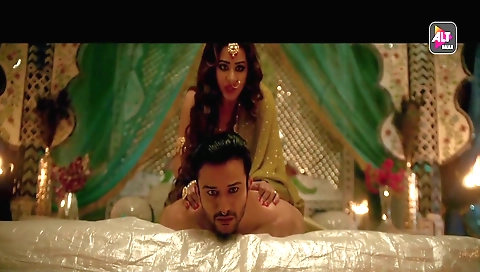 Busty brunette has her lips spread wide open while licking